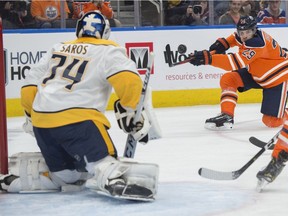 Leon Draistaitl of the Edmonton Oilers, flips the puck towards goalie Juuse Saros of the Nashville Predators at Rogers Place in Edmonton on October 20, 2018.