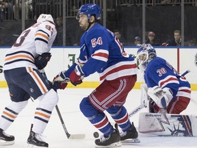 Edmonton Oilers center Ryan Nugent-Hopkins (93) scores a goal past New York Rangers defenseman Adam McQuaid (54) and goaltender Henrik Lundqvist (30) during the first period of an NHL hockey game, Saturday, Oct. 13, 2018, at Madison Square Garden in New York.