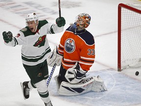 Minnesota Wild's Charlie Coyle celebrates after teammate Eric Staal (not in photo) scored on Edmonton Oilers' goalie Cam Talbot during second period NHL action at Rogers Place, Tuesday, Oct. 30, 2018.