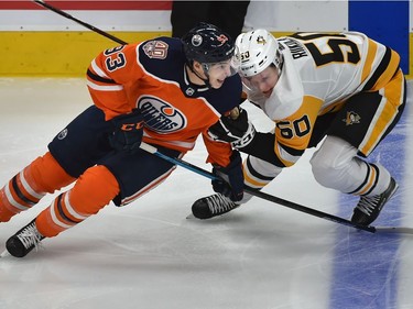 Edmonton Oilers Ryan Nugent-Hopkins gets away from Pittsburgh Penguins Juuso Riikola during NHL action at Rogers Place on Tuesday, Oct. 23, 2018.