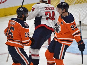 Edmonton Oilers forward Ryan Nugent-Hopkins, right, celebrates scoring a shorthanded goal with teammate Jujhar Khaira on Washington Capitals goalie Braden Holtby (70) during NHL action at Rogers Place in Edmonton, Oct. 25, 2018.