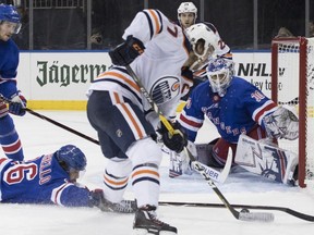 Edmonton Oilers center Connor McDavid (97) shoots the puck to score past New York Rangers right wing Mats Zuccarello (36) and goaltender Henrik Lundqvist (30) during the third period of an NHL hockey game, Saturday, Oct. 13, 2018, at Madison Square Garden in New York. The Oilers won 2-1.