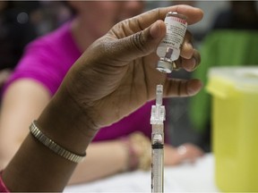 Alberta kicked off its annual influenza vaccination campaign on Monday, Oct. 15, 2018. A file photo shows a vaccine being prepared in a recent campaign.