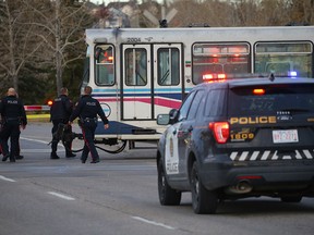 Police investigate the scene of a pedestrian hit by a CTrain at 162 Ave. S.E.. Photo by Al Charest, Postmedia Network.