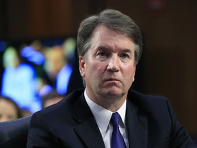 In this Sept. 4, 2018 photo, Supreme Court nominee Brett Kavanaugh, listens to Sen. Cory Booker, D-N.J. speak during a Senate Judiciary Committee nominations hearing on Capitol Hill in Washington.