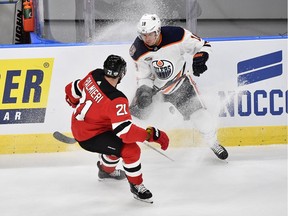 New Jersey Devils' Kyle Palmieri, left and Edmonton Oilers' Ryan Strome vie for the puck, during the season-opening NHL Global Series hockey match between Edmonton Oilers and New Jersey Devils at Scandinavium in Gothenburg, Sweden, Saturday, Oct. 6, 2018, (Bjorn Larsson Rosvall /TT News Agency via AP) ORG XMIT: AMB822