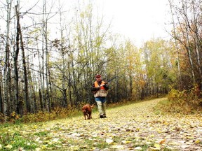 Neil and Penny hunt a Beaver Hills oil road. Neil Waugh/Edmonton Sun