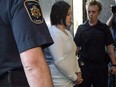 Terri-Lynne McClintic is escorted into court in Kitchener, Ont., on Wednesday, September 12, 2012.