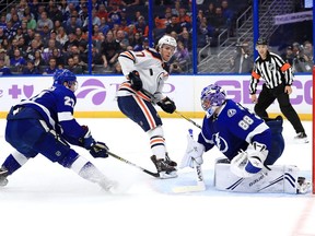 Andrei Vasilevskiy (88) of the Tampa Bay Lightning stops a shot from Connor McDavid (97) of the Edmonton Oilers during a game at Amalie Arena on November 6, 2018 in Tampa, Florida.