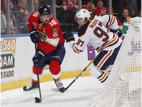 Connor McDavid (97) of the Edmonton Oilers defends against Aleksander Barkov (16) of the Florida Panthers during first period action at the BB&T Center on Nov. 8, 2018 in Sunrise, Florida. Joel Auerbach / Getty Images