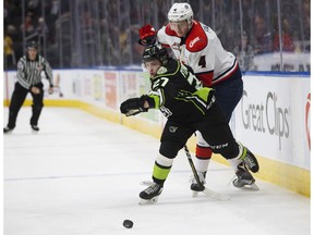 The Edmonton Oil Kings' Trey Fix-Wolansky (27) battles the Lethbridge Hurricanes' Danila Palivko (4) during second period WHL action at Rogers Place, in Edmonton Sunday Oct. 28, 2018.
