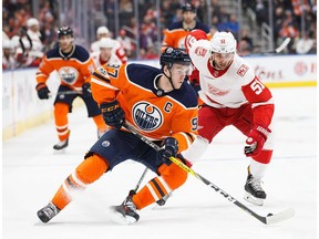 Connor McDavid #97 of the Edmonton Oilers is pursued by Frans Nielsen #51 of the Detroit Red Wings at Rogers Place on November 5, 2017 in Edmonton.
