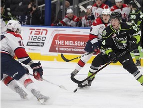 The Edmonton Oil Kings' Brett Kemp (24) battles the Lethbridge Hurricanes' Noah Boyko (19) during first period WHL action at Rogers Place, in Edmonton Sunday Oct. 28, 2018.