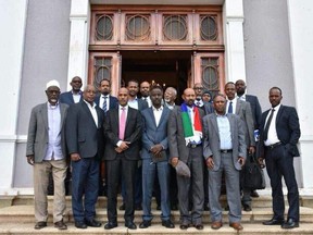 Ahmed Abdulkadir, in blue suit centre, with Ogaden National Liberation Front representatives and Ethiopian government leaders during peace talks in Asmara, Eritrea, this summer. Abdulkadir, who lives in Edmonton, was asked by the ONLF to serve as a go-between during historic peace talks with the Ethiopian government.