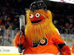 In this Sept. 24, 2018, file photo, the Philadelphia Flyers new mascot, Gritty, takes to the ice during the first intermission of the Flyers' preseason NHL hockey game against the Boston Bruins in Philadelphia.