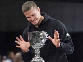 Ottawa Redblacks quarterback Trevor Harris (7) does not touch the Grey Cup during media day a head of the106th Grey Cup in Edmonton on Thursday, November 22, 2018.