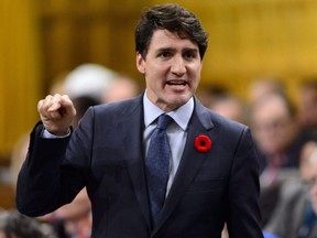 Prime Minister Justin Trudeau stands during question period in the House of Commons on Parliament Hill in Ottawa on Wednesday, Nov. 7, 2018.