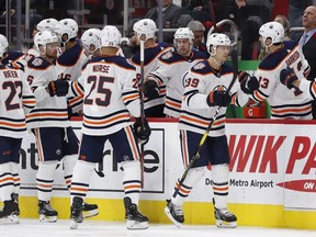 Edmonton Oilers right wing Alex Chiasson (39) fist bumps teammates after scoring during the second period of an NHL hockey game against the Detroit Red Wings, Saturday, Nov. 3, 2018, in Detroit.