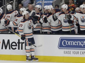 Edmonton Oilers center Connor McDavid (97) celebrates with teammates after scoring against the San Jose Sharks during the first period of an NHL hockey game in San Jose, Calif., Tuesday, Nov. 20, 2018.