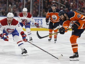 Edmonton's Zack Kassian (44) shoots past Montreal's Jeff Petry (26) during the third period of a NHL game between the Edmonton Oilers and the Montreal Canadiens in Edmonton, Alberta on Saturday, December 23, 2017.