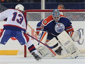 Winnipeg Jets forward Teemu Selanne beats Edmonton Oilers goaltender Curtis Joseph on a penalty shot for the winning goal in the Heritage Classic alumni game in Winnipeg on Sat., Oct. 22, 2016. Kevin King/Winnipeg Sun/Postmedia Network