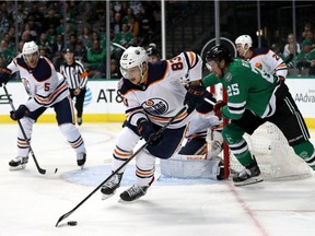 Matt Benning of the Edmonton Oilers skates the puck against the Dallas Stars in the first period at American Airlines Center on Monday, Dec. 03, 2018 in Dallas, Texas.