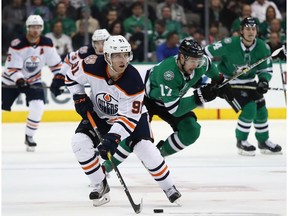 Drake Caggiula #91 of the Edmonton Oilers skates the puck against the Dallas Stars in the second period at American Airlines Center on December 03, 2018 in Dallas, Texas.