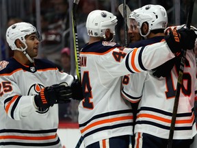 DENVER, COLORADO - DECEMBER 11: Kyle Brodziak #28 of the Edmonton Oilers is congratulated by Darnell Nurse #25, Zack Kassian #44 and Jujhar Khaira #16 after scoring a goal against the Colorado Avalanche in the first period at Pepsi Center on December 11, 2018 in Denver, Colorado. (Photo by Matthew Stockman/Getty Images)