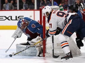 Goalie Semyon Varlamov of the Colorado Avalanche saves a shot on goal by Connor McDavid of the Edmonton Oilers in the first period at Pepsi Center on December 11, 2018 in Denver, Co.