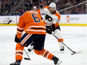 The Edmonton Oilers' Adam Larsson (6) battles the Philadelphia Flyers' Jakub Voracek (93) during second period NHL action at Rogers Place, in Edmonton Friday Dec. 14, 2018.