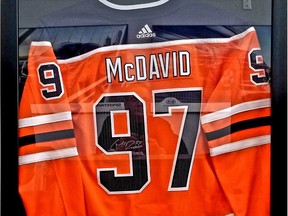 A signed Connor McDavid jersey is just the start to Adopt-A-Teen's Oilers Past and Present auction package. Photo by Tom Braid