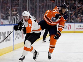 The Edmonton Oilers defenceman Darnell Nurse (25) collides with the Philadelphia Flyers' Ivan Provorov (9) during first period NHL action at Rogers Place, in Edmonton Friday Dec. 14, 2018.