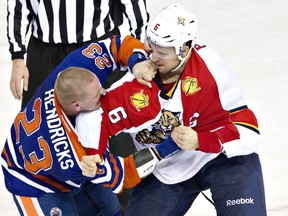 Florida Panthers' Alex Petrovic (6) and Edmonton Oilers' Matt Hendricks (23) fight during second period NHL action in Edmonton, Alta., on Sunday January 10, 2016. THE CANADIAN PRESS/Jason Franson