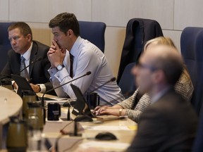 In his letter to Edmonton City Council members and Mayor Don Iveson (second from left), Cam Tait asks them to keep DATS as a priority.