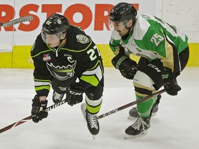 Edmonton Oil Kings captain Trey Fix-Wolansky (left) is checked by Prince Albert Raiders Sean Montgomery during third period WHL hockey game action in Edmonton on Wednesday November 28, 2018. (PHOTO BY LARRY WONG/POSTMEDIA)