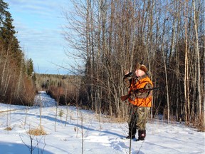 Neil on a deer stand beside an oil road. Neil Waugh/Edmonton Sun