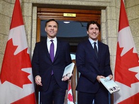 Finance Minister Bill Morneau and Prime Minister Justin Trudeau leave the prime minister's office to table the federal budget in the House of Commons in Ottawa on Tuesday, Feb. 27, 2018. (THE CANADIAN PRESS/Sean Kilpatrick)