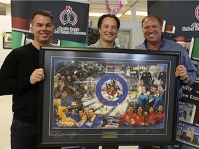 An Edmonton curling team skipped by Randy Ferbey was inducted into the Alberta Sports Hall of Fame. Three of the team members — David Nedohin, left, Scott Pfeifer and Marcel Rocque — were in Edmonton to accept the induction on Monday, Dec. 3, 2018.