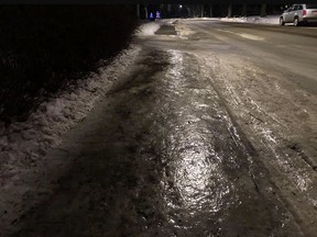 Ice covers much of Edmonton's sidewalks including this dandy of a glacier. (Photo by Janet French)