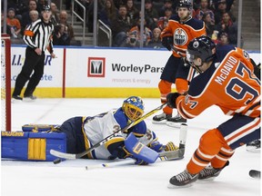 Edmonton's Connor McDavid (97) scores on St. Louis' goaltender Jake Allen (34) during the third period of an NHL game between the Edmonton Oilers and the St. Louis Blues at Rogers Place in Edmonton, Alberta on Thursday, December 21, 2017.