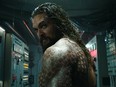 Jason Momoa stars as Aquaman, a half-Atlantean, half-human who is reluctant to be king of the undersea nation of Atlantis. (Warner Bros.)