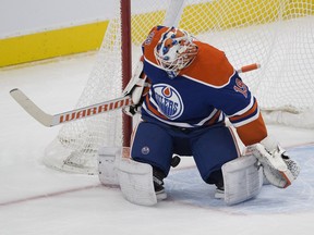 Edmonton Oilers goalie Mikko Koskinen (19) loses track of the puck during first period play against the Calgary Flames on Sunday, Dec. 9, 2018 in Edmonton.