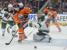 Alex Chiasson of the Edmonton Oilers, is unable to handle the puck in front of goalie Alex Stalock of the Minnesota Wild at Rogers Place in Edmonton on  December 7, 2018.   Shaughn Butts / Postmedia