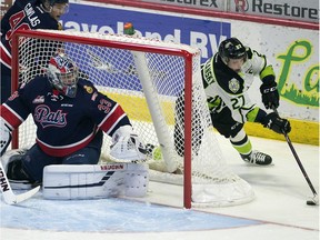 Regina Pats goalie Max Paddock slides across the net as Edmonton Oil Kings Trey Fix-Wolansky tries the wrap around at the Brandt Centre in Regina on Nov. 2, 2018.