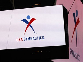FILE - In this Feb. 26, 2014, file photo, the USA Gymnastics logo is displayed at AT&T Stadium in Arlington, Texas.(Ron Jenkins/Star-Telegram via AP) ORG XMIT: TXFOR501