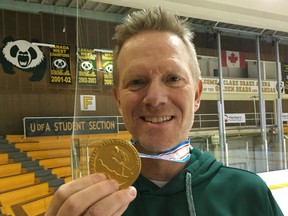 University of Alberta Pandas hockey coach Howie Draper displays the gold medal won by the Canadian national team he head coached at the 2019 IIHF U18 women's world championship held in Obihiro, Japan from Jan. 5-13.