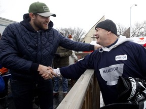 The Edmonton Oilers' Leon Draisaitl shakes hands with incoming Edmonton police chief Dale McFee during the 10th annual McCauley Cup at the McCauley outdoor skating rink, 10750 96 Street, in Edmonton Friday Dec. 28, 2018. During the annual event Downtown Division police officers play McCauley neighbourhood kids in a game of hockey. Photo by David Bloom