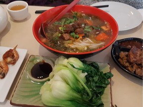 A full meal - beef noodles, shrimp, lemongrass chicken and bok choy at Cui Hua Gui Lin Noodle House. GRAHAM HICKS/EDMONTON SUN