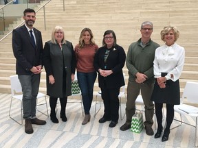 Mayor Don Iveson, left, stands with panel members at the release of the 2019 Edmonton Women's Quality of Life Scorecard on Friday, Jan. 25, 2019.