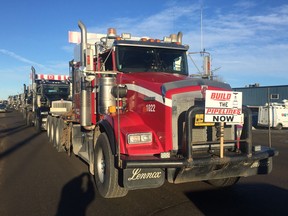 Hundreds of trucks line up for a convoy event in Nisku, Alta. on Wednesday, Dec. 19, 2018.